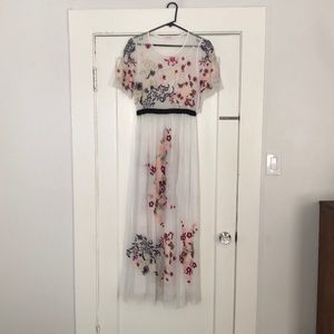 White with embroidered flowers maxi dress.